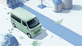 画像：葉が落ち、側で川が流れている道路を走行するe-ハイゼット カーゴ 4シーター