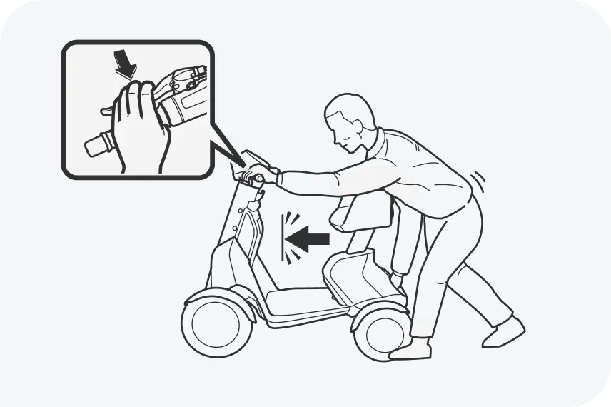 イラスト:e-SNEAKERのブレーキレバーと手押しスイッチを押して、動かないことを確認している男性